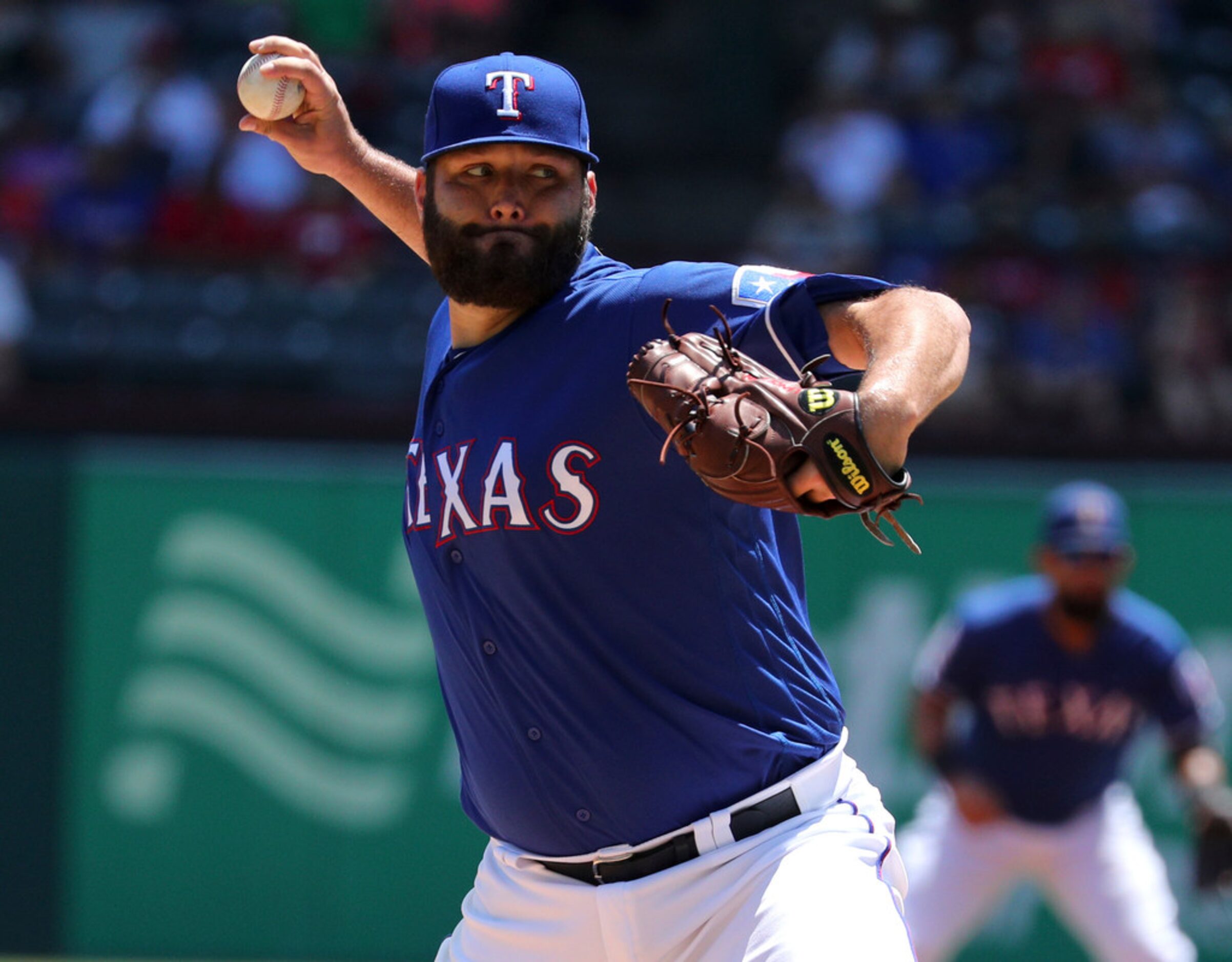 Texas Rangers starting pitcher Lance Lynn (35) delivers a pitch against the Minnesota Twins...