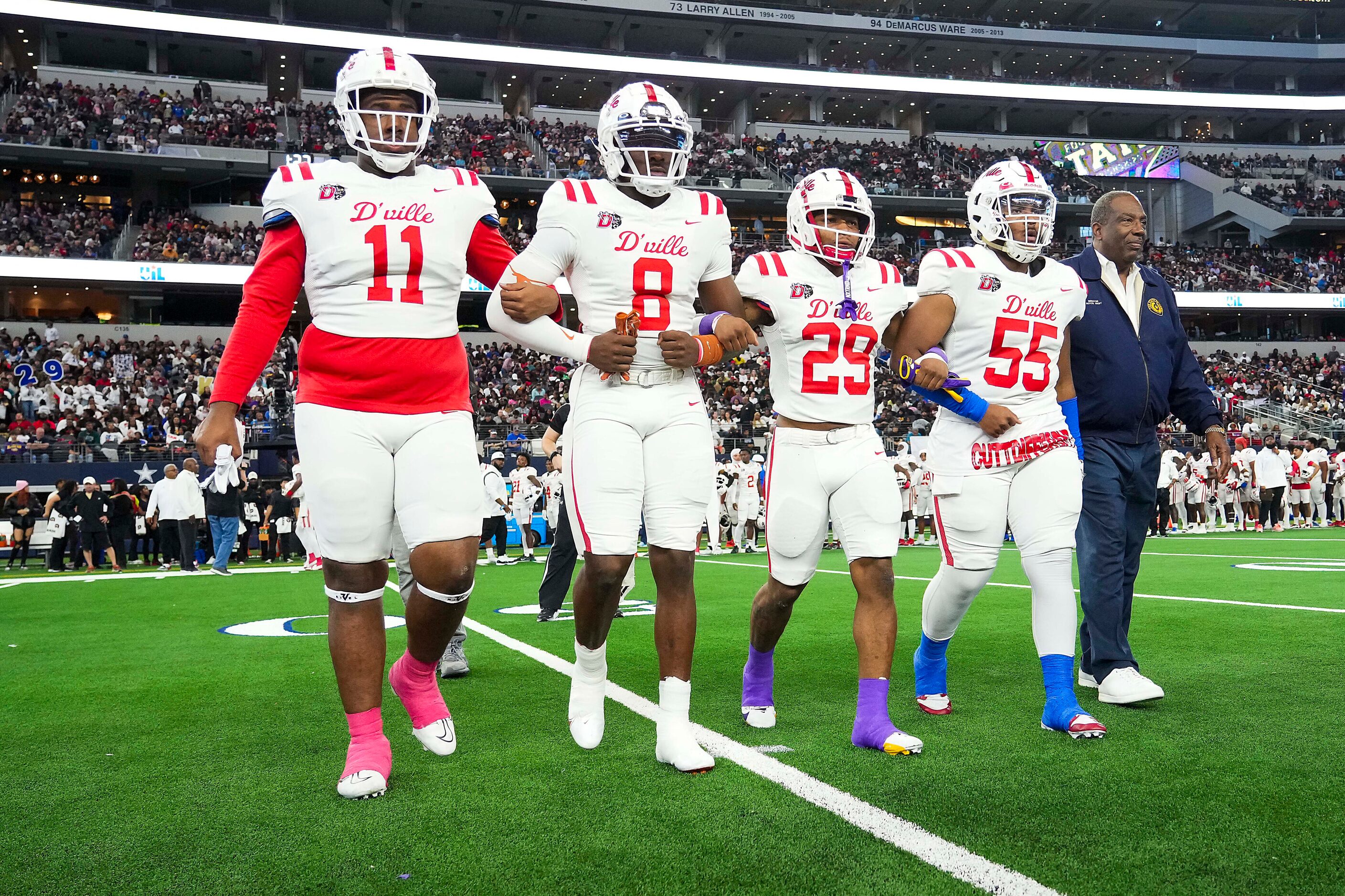 Duncanville’s  Alex January (11), Colin Simmons (8), Caden Durham (29) and Damian Martinez...