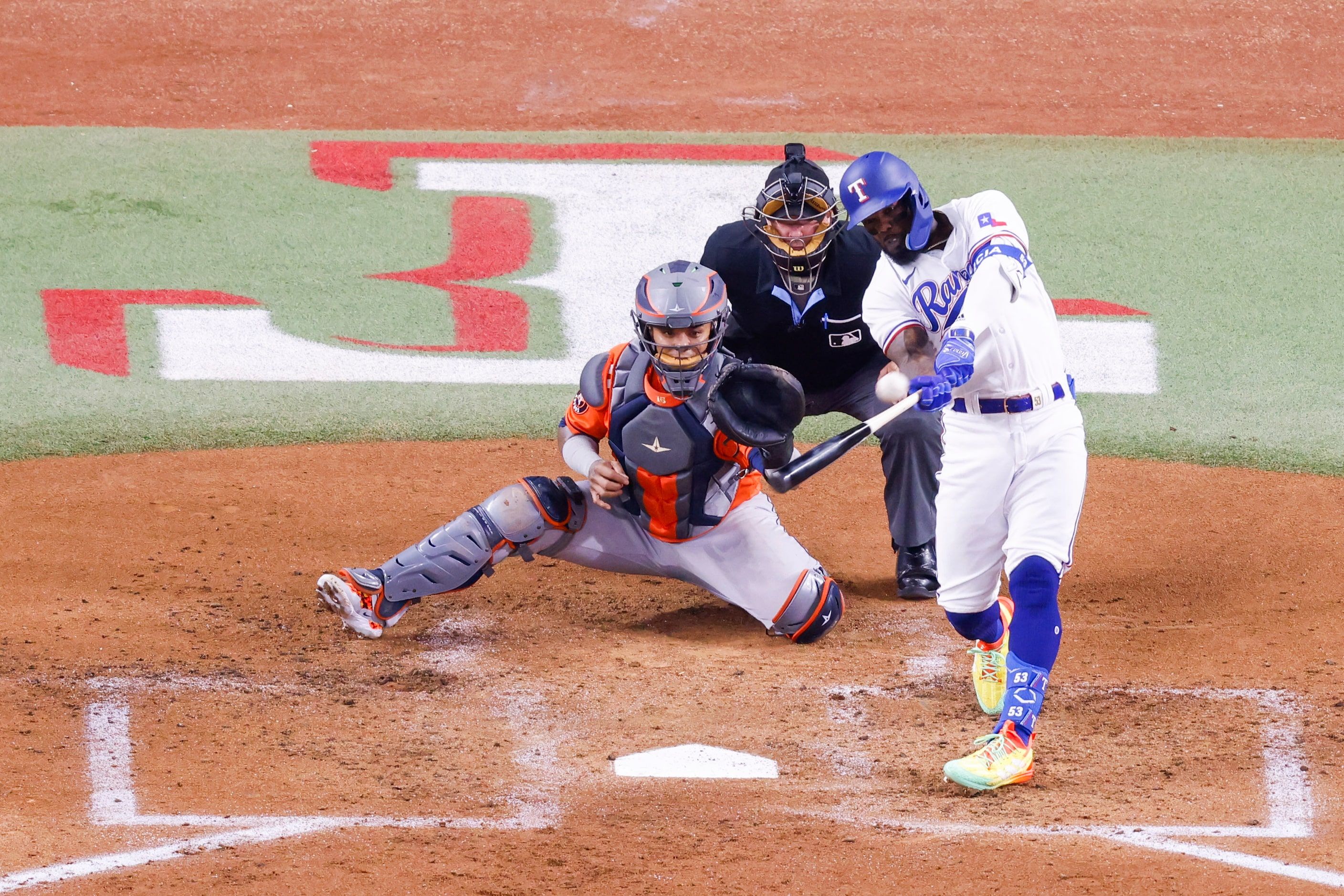 Texas Rangers right fielder Adolis Garcia (53) hits a home run during the second inning of...