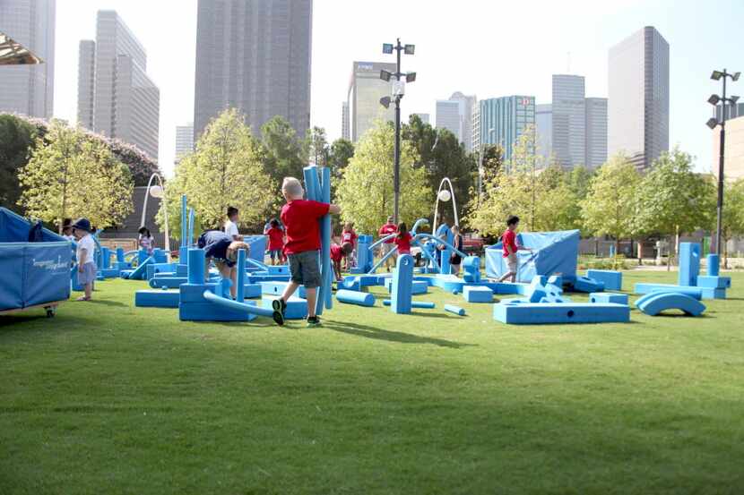 Children create and build so they can enjoy the Imagination Playground at Klyde Warren Park. 