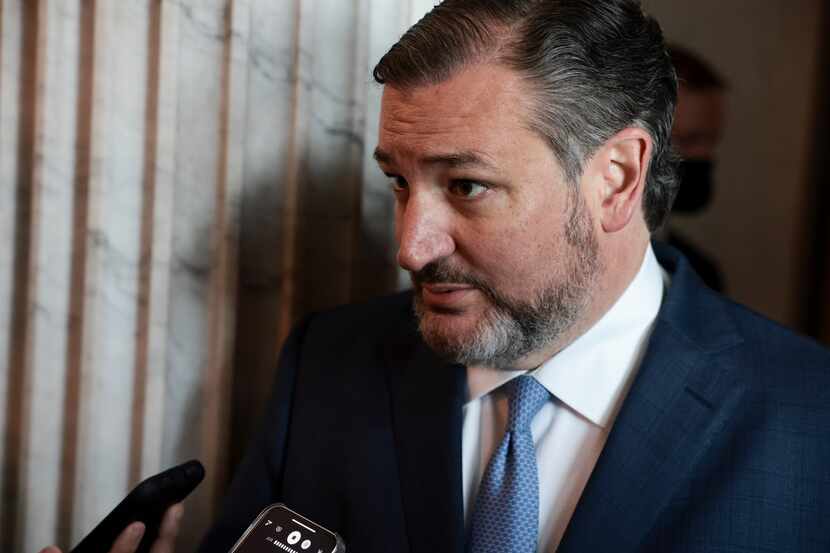 Sen. Ted Cruz speaks with reporters as he arrives to a luncheon with Senate Republicans at...