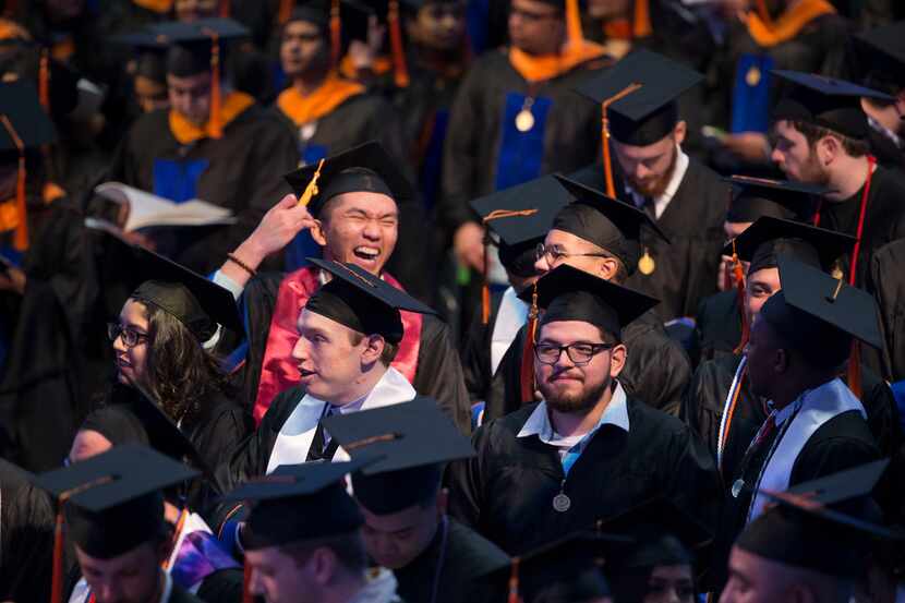 Students participate in the graduation ceremony for the University of Texas at Arlington's...