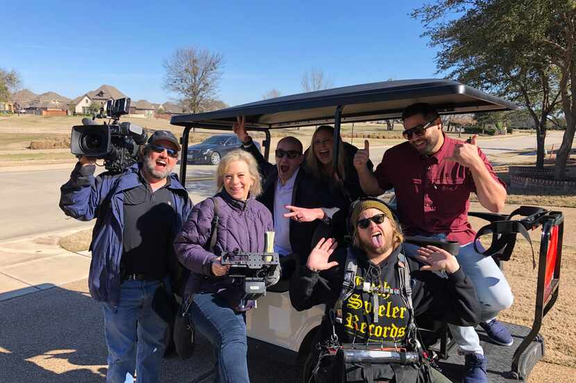 Realtor Tommy Pistana (in sunglasses) with Anthony and Erin Ilnicky (golf cart) and members...