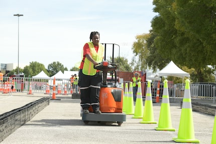 A Coca-Cola associate maneuvers a pallet jack through an obstacle course at the Truck Rodeo...