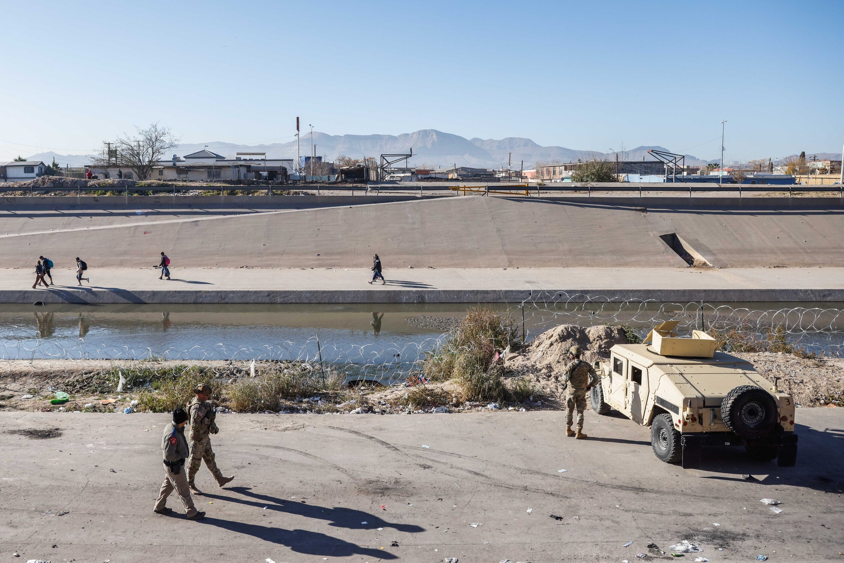 The Texas National Guard guards the US-Mexico border from the banks of the Rio Grande River...