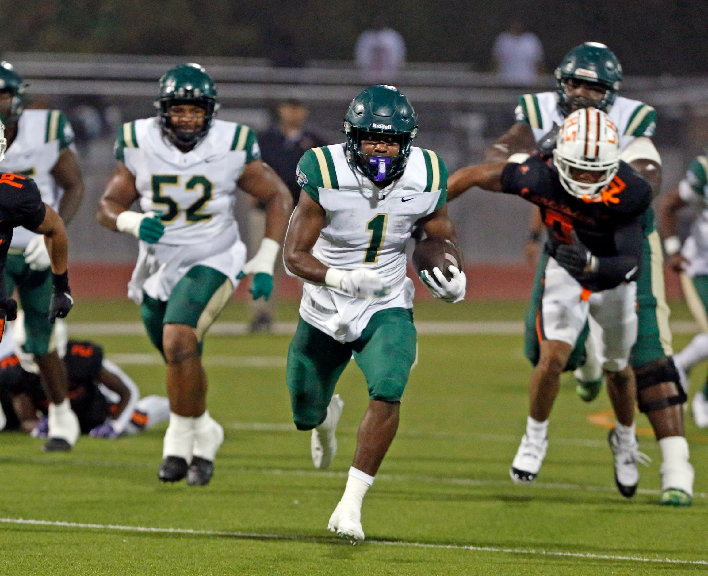 DeSoto High RB Deondrae Riden Jr. (1) breaks loose for a long gain and a first down during...