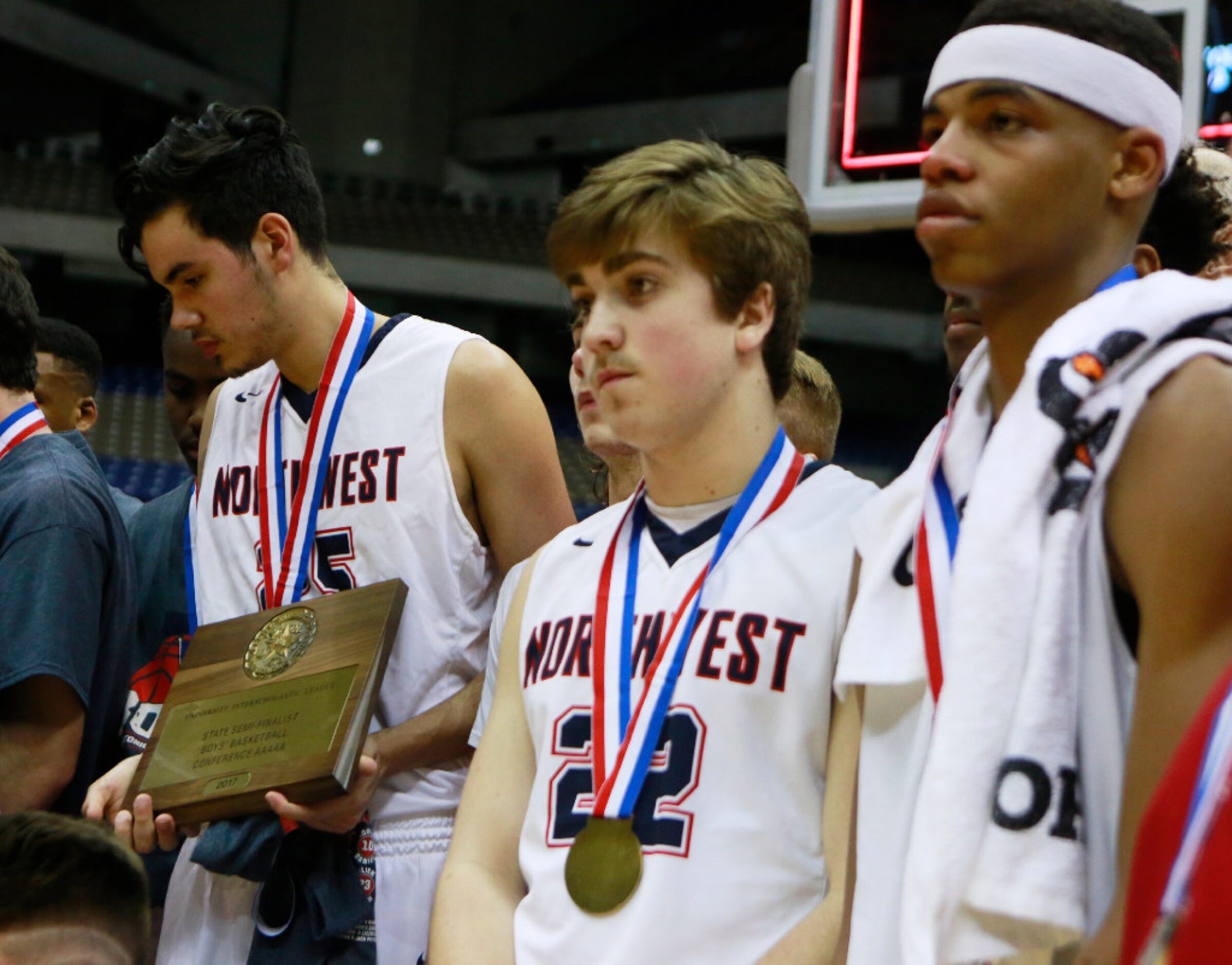 Justin Northwest's Fernando Ruiz (25), Christian Healer (22) and Avery Anderson (3) pose for...