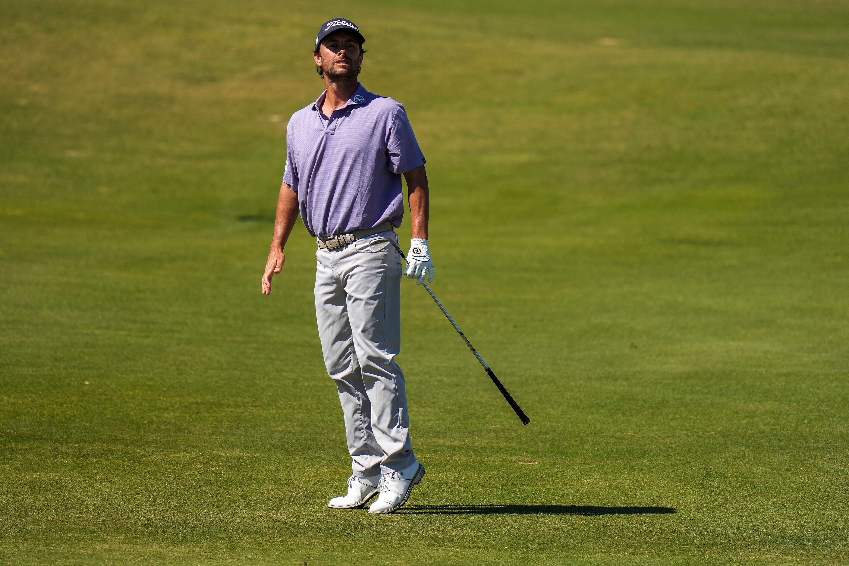 Spencer Levin watches his approach shot hit the green on the 13th hole during the final...