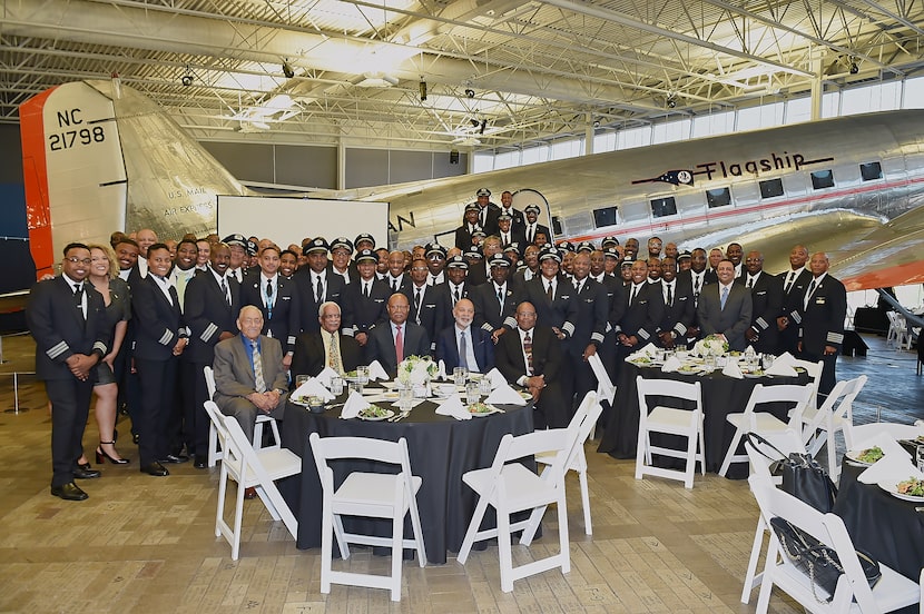 Capt. David Harris surrounded by many pilots he inspired.