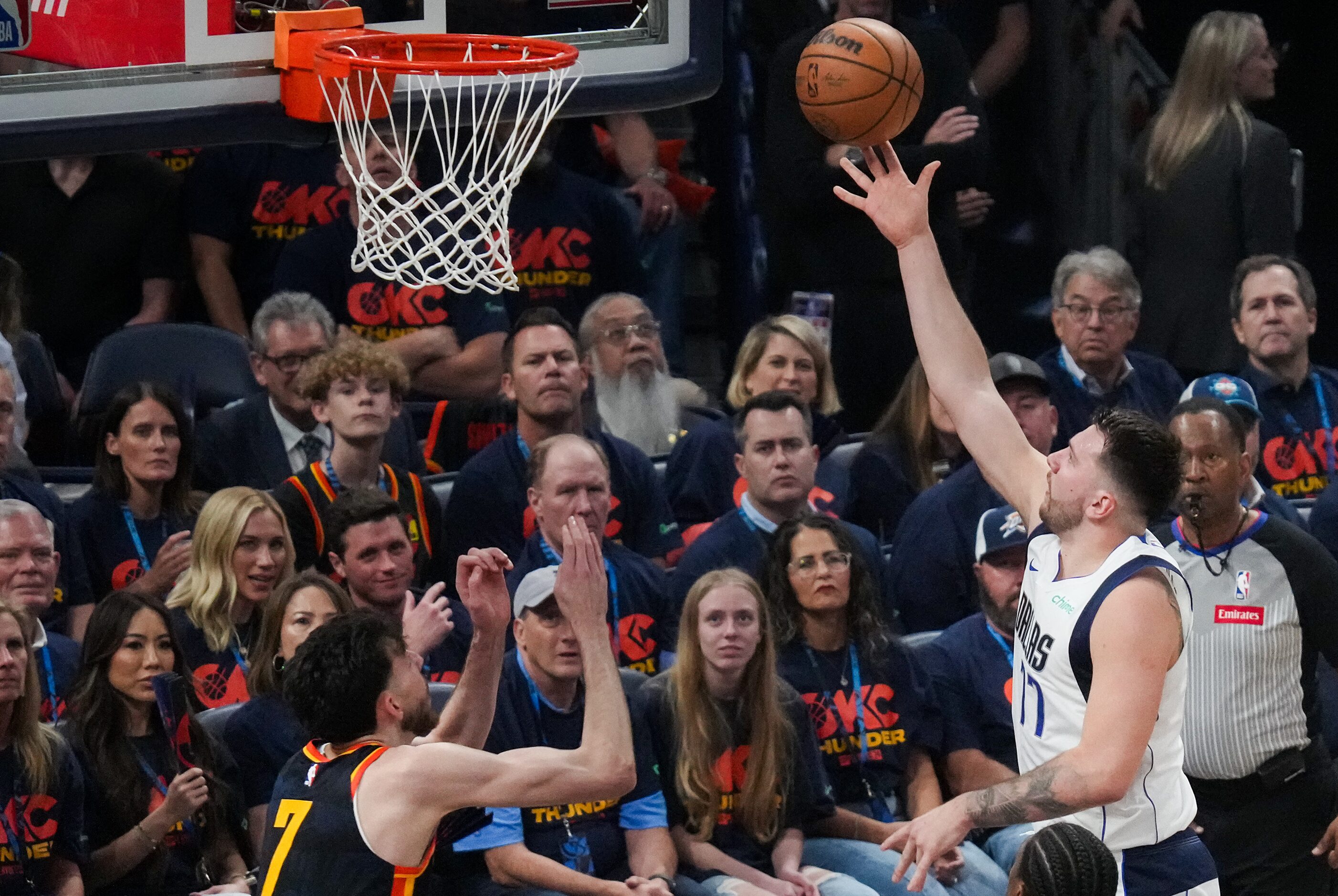 Dallas Mavericks guard Luka Doncic (77) goes for a layup as Oklahoma City Thunder forward...