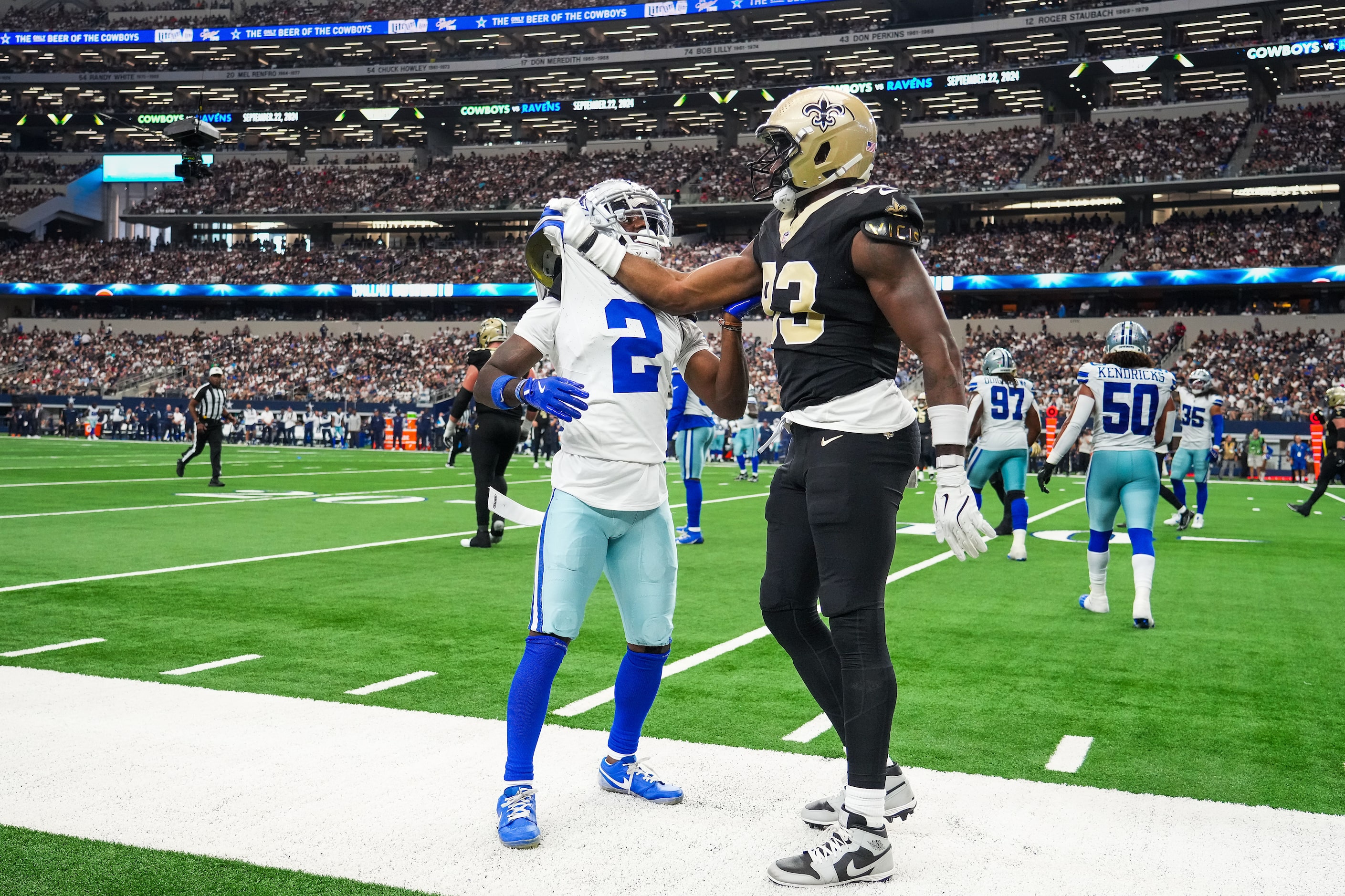 Dallas Cowboys cornerback Jourdan Lewis (2) tussles with New Orleans Saints tight end Juwan...