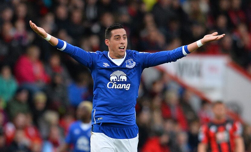 Everton's Argentinian defender Ramiro Funes Mori celebrates scoring his team's first goal...