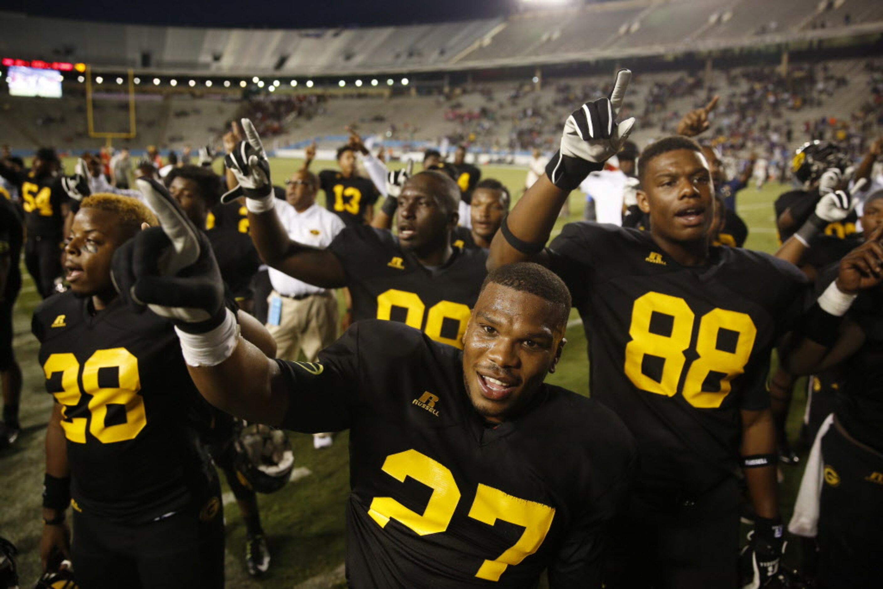 Grambling State defensive back Tyree Hollins (27) celebrates with teammates after beating...