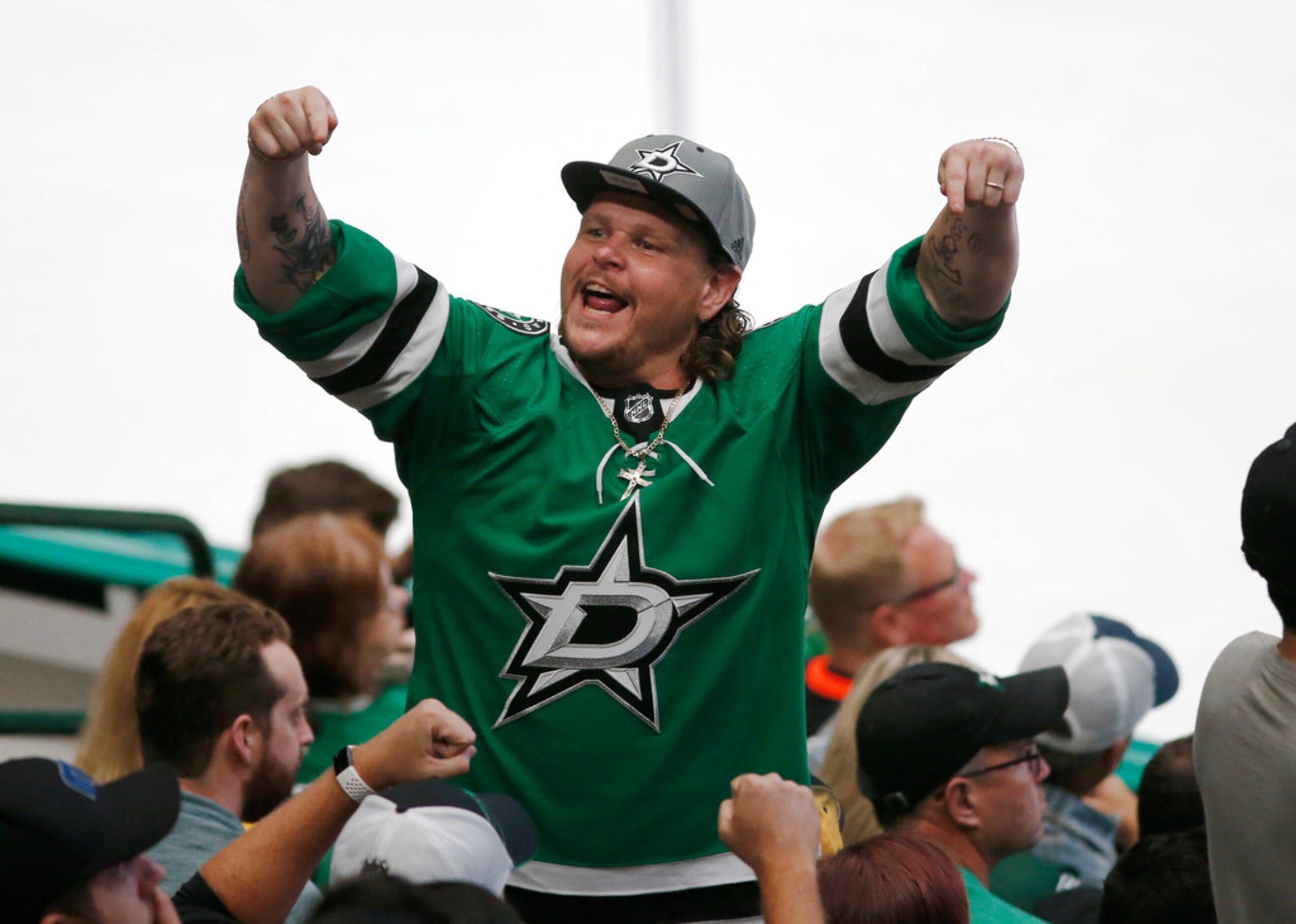 Dallas Stars fan attempts to pump the fans up during the third period of play in the home...