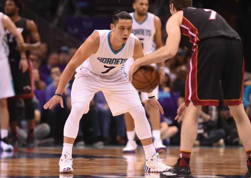 Apr 29, 2016; Charlotte, NC, USA; Charlotte Hornets guard Jeremy Lin (7) defends Miami Heat...