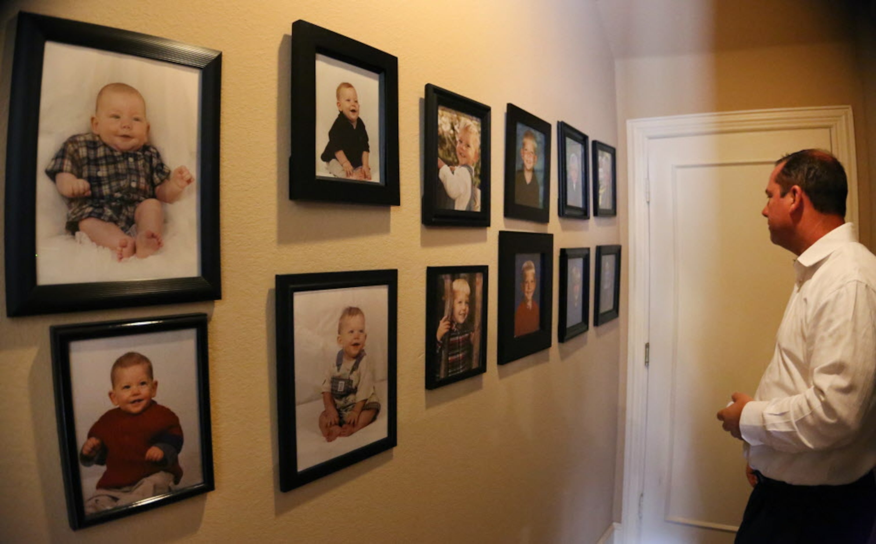 Preston Pomykal looks at a wall of photos of his son Paxton, a 17-year-old member of FC...