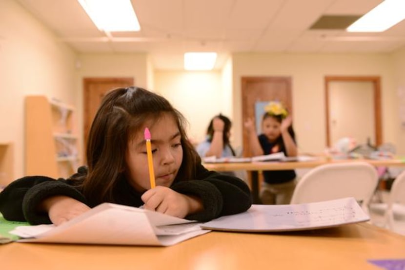 

Jaquelin Martinez, 5, does her homework during the after-school program at Wesley-Rankin...