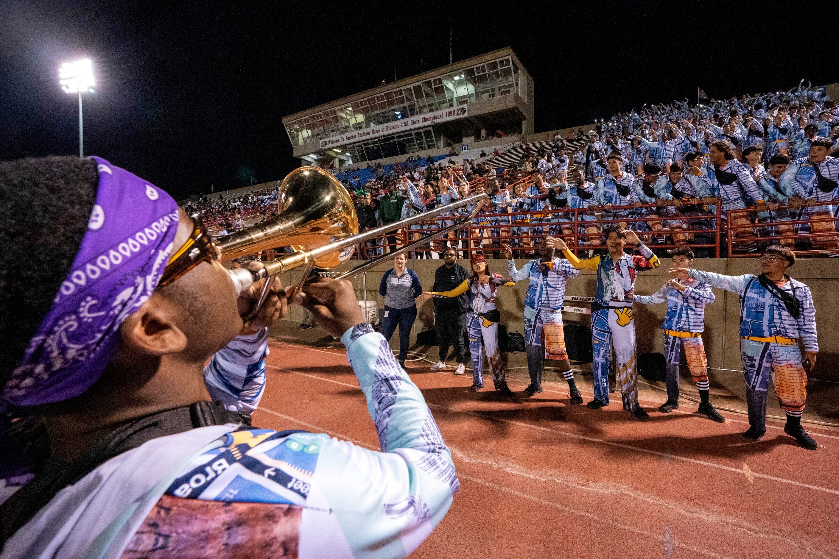 Duncanville junior trombone player Xzavier Elliott leads the band during the second half of...