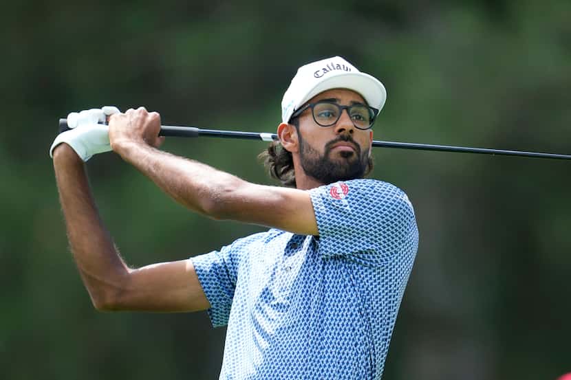 Akshay Bhatia hits off the fourth tee during the first round of the Rocket Mortgage Classic...