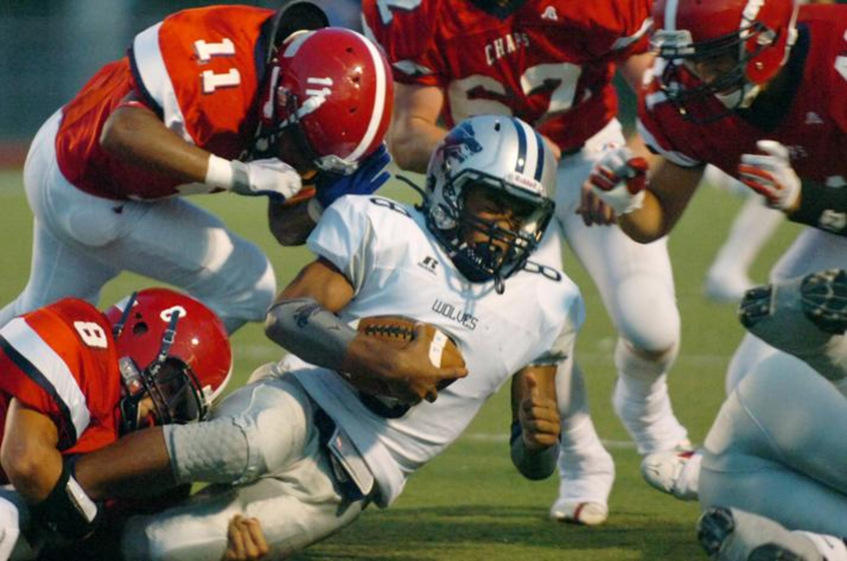 Carrollton Ranchview junior running back Marcus Wimby (8) is clobbered by Aubrey junior...