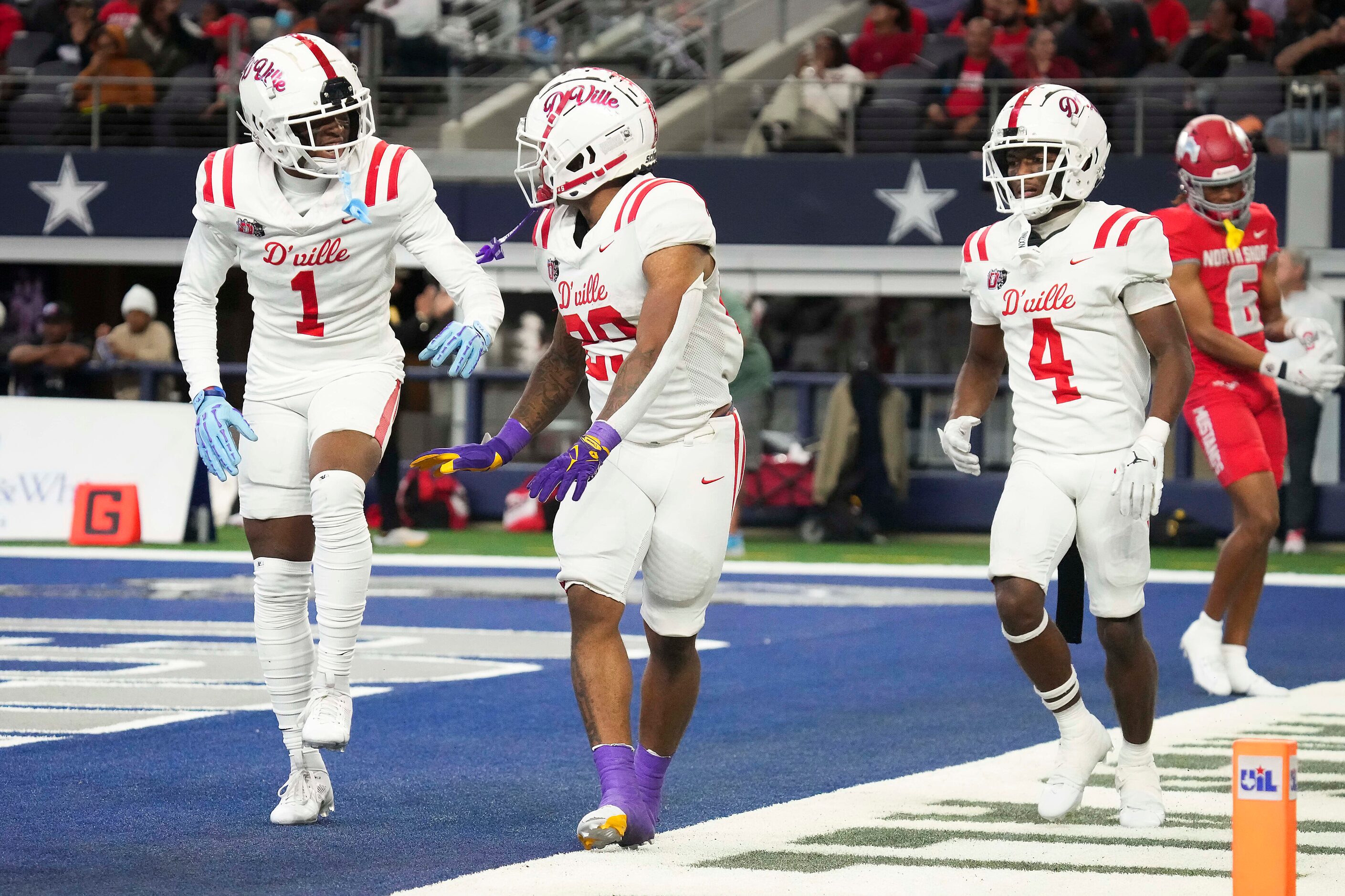 Duncanville running back Caden Durham (29) celebrates with Dakorien Moore (1) after scoring...