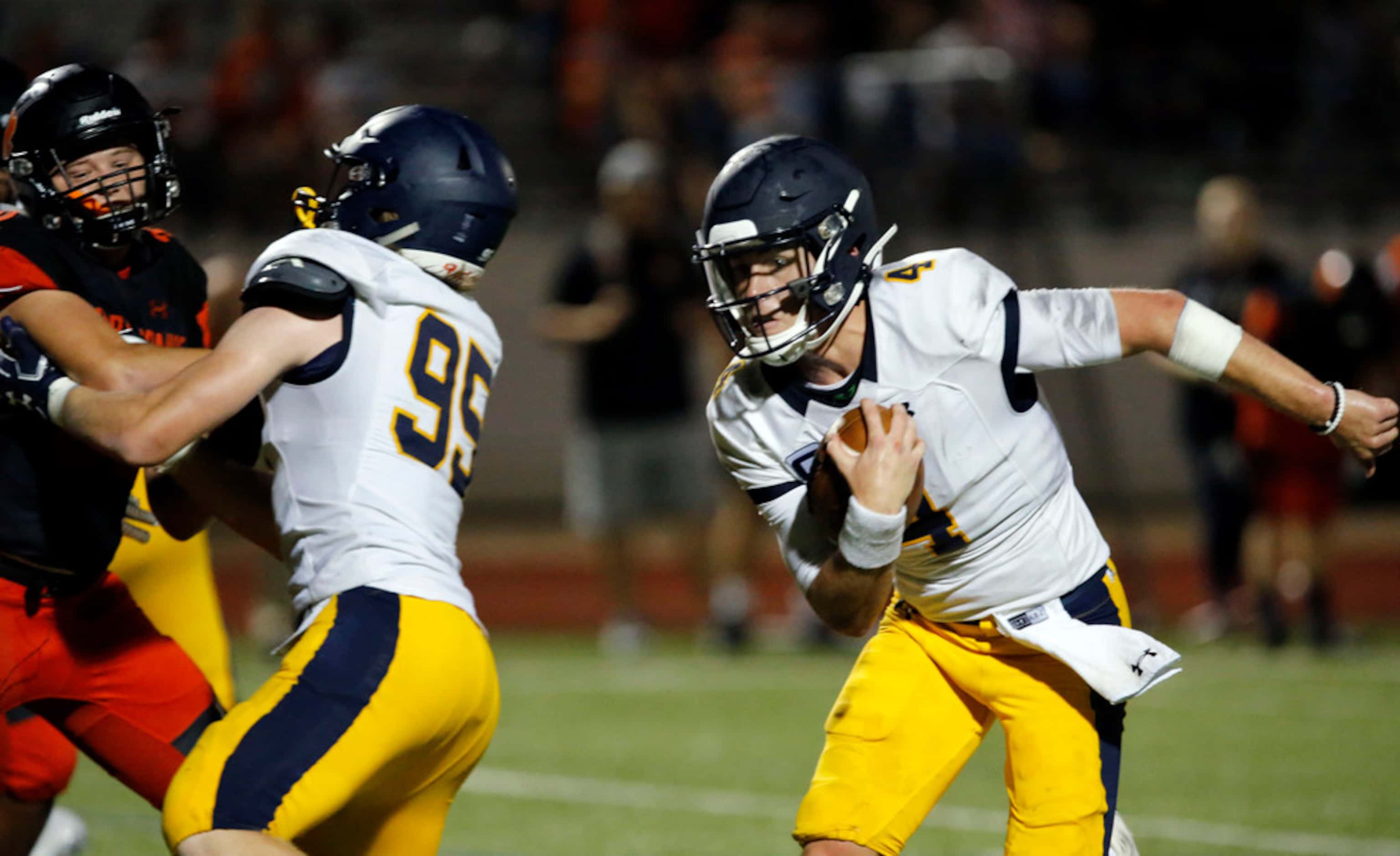 Highland Park quarterback Chandler Morris (4) finds an opening and heads to the end zone for...
