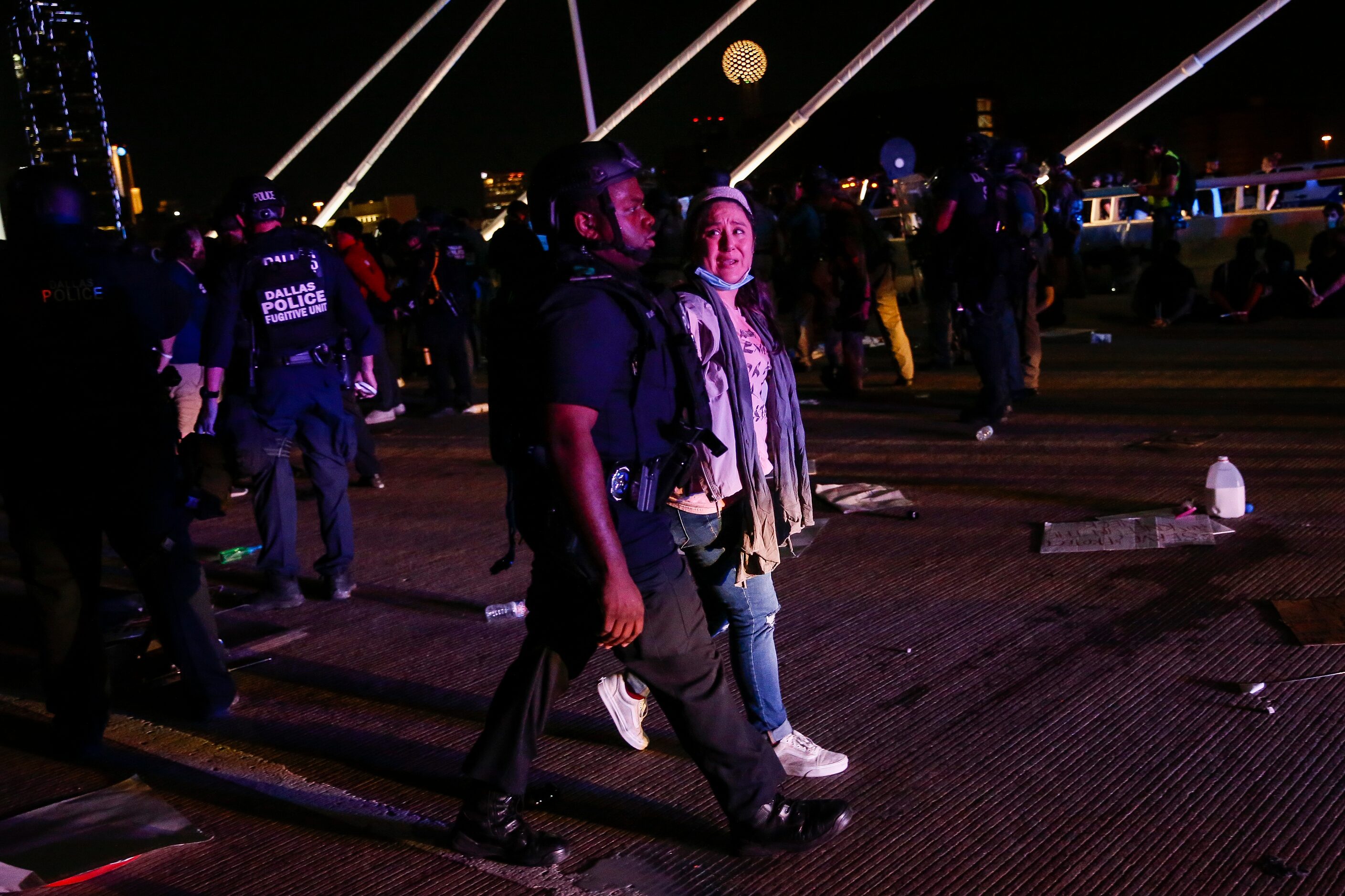 Police surround and detain hundreds of protesters who marched onto the Margaret Hunt Hill...