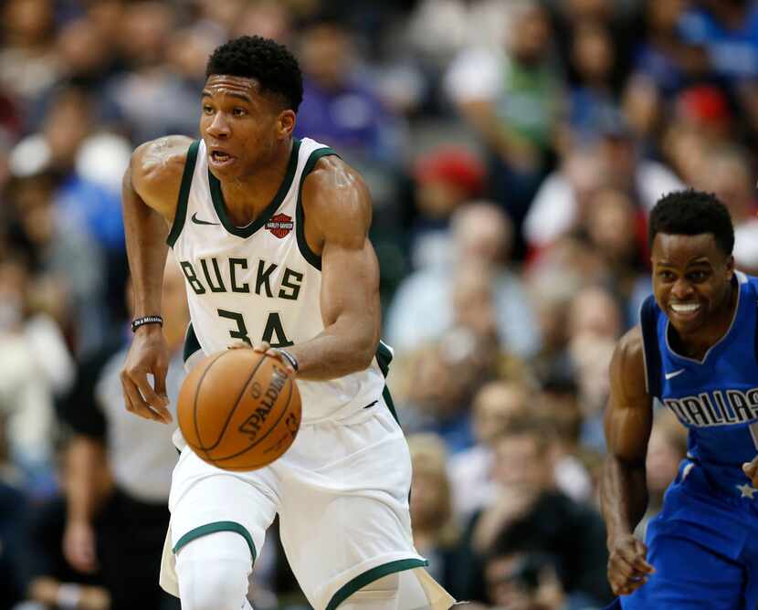 Milwaukee Bucks forward Giannis Antetokounmpo (34) brings the ball up the court after...