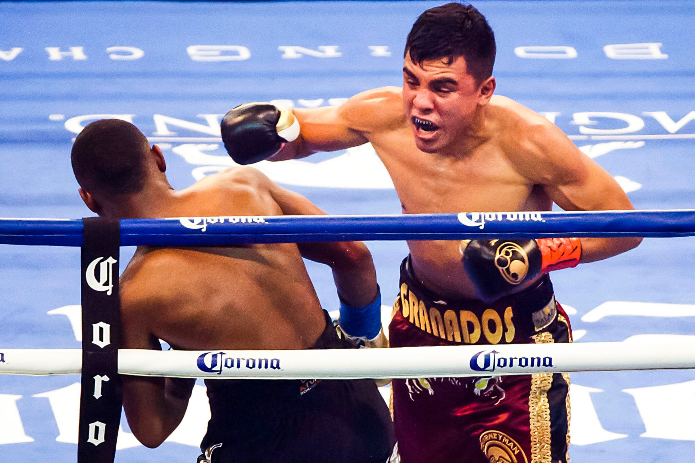 Adrian Granados, of Chicago, Illinois, (right) fights Javier Fortuna, of La Romana,...