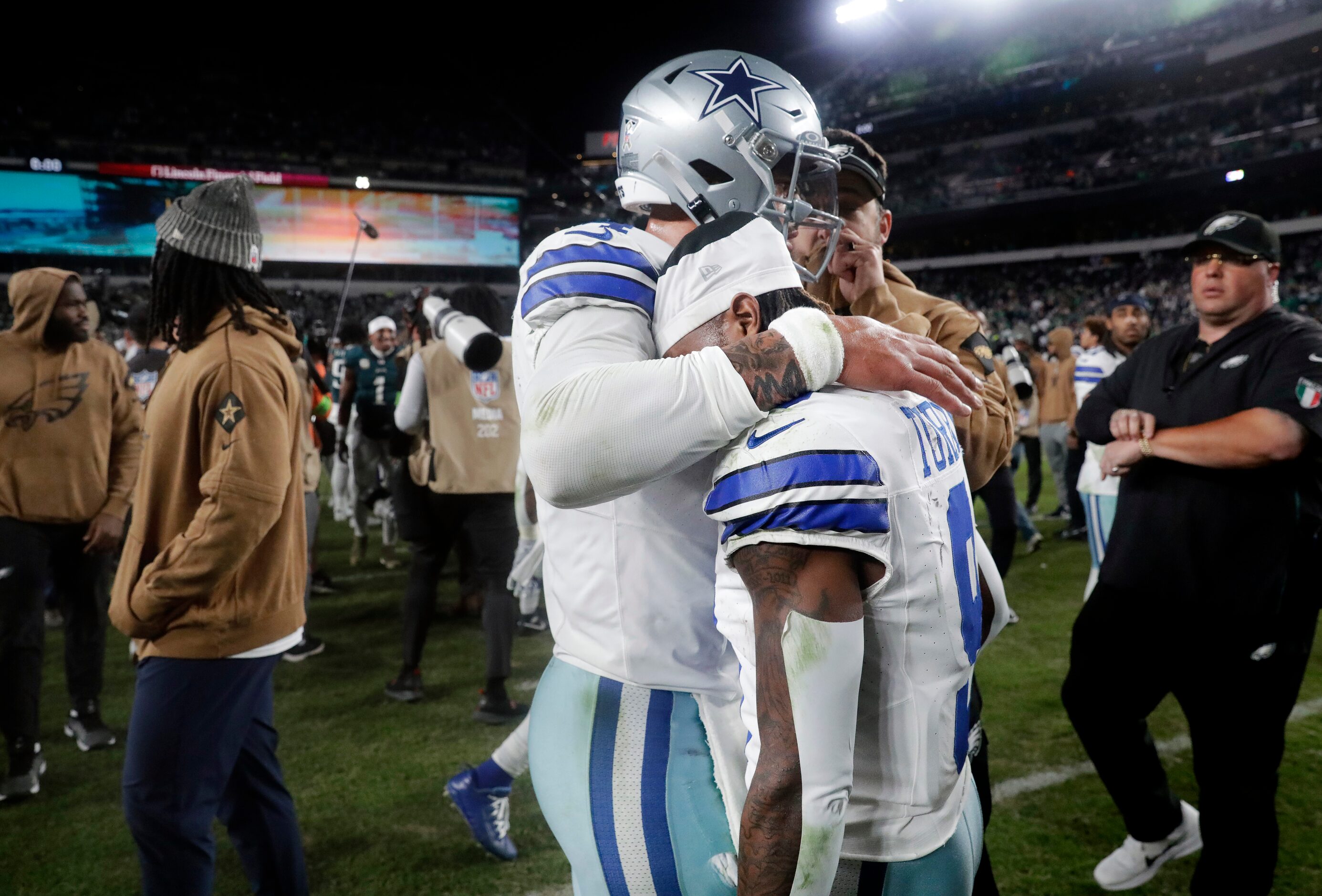 Dallas Cowboys quarterback Dak Prescott (4) consoles wide receiver KaVontae Turpin (9)...