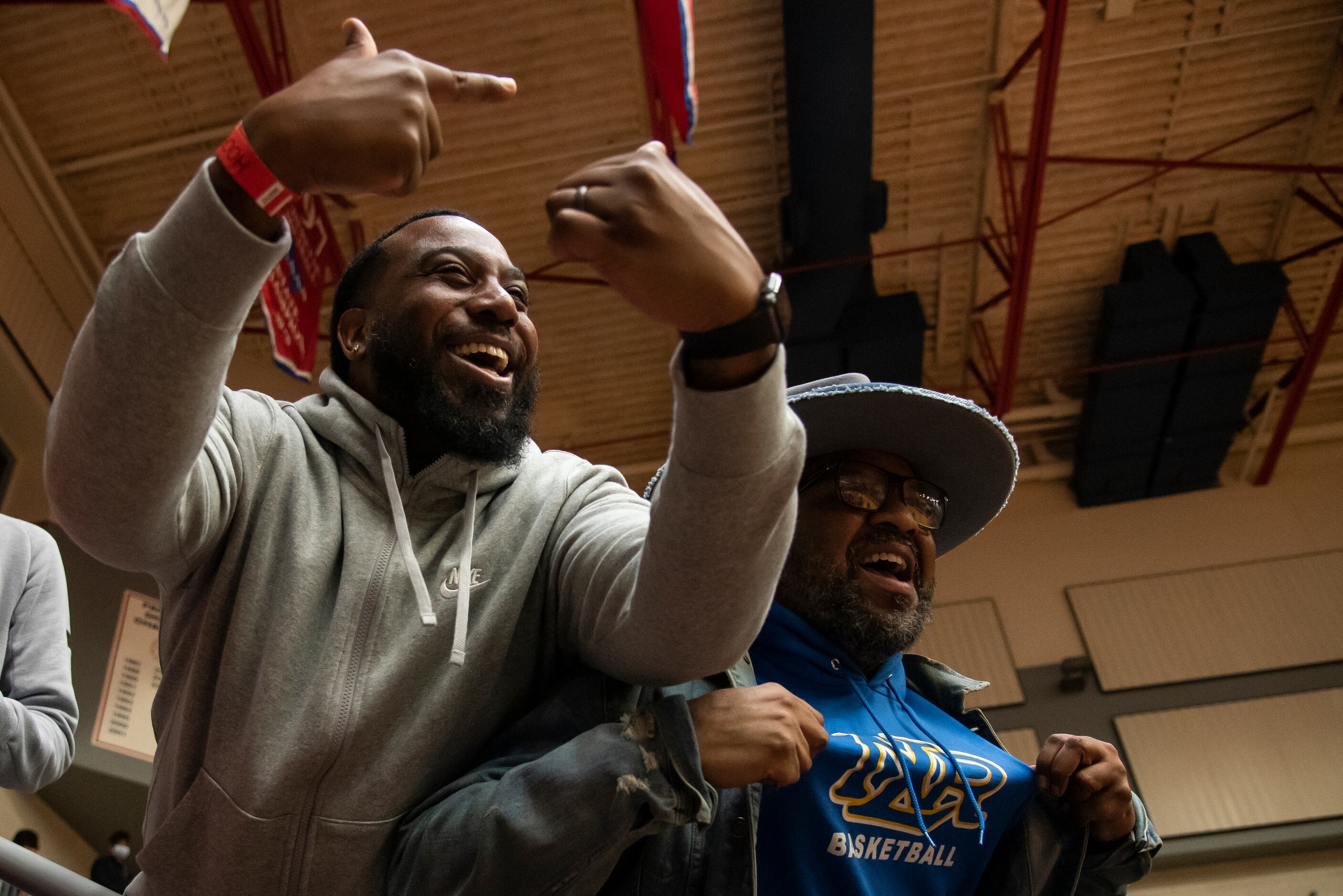 From left, North Little Rock fans Vernon Lawrence and Tramon Arnold cheer on their team...