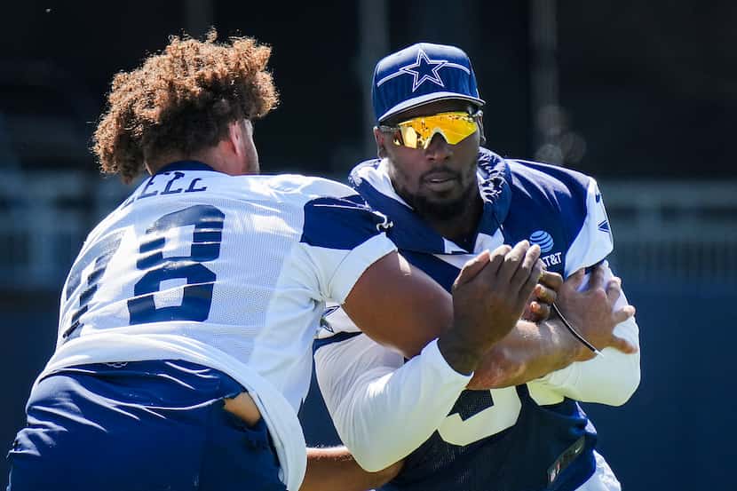 Dallas Cowboys defensive end Demarcus Lawrence (90) works against offensive lineman Terence...