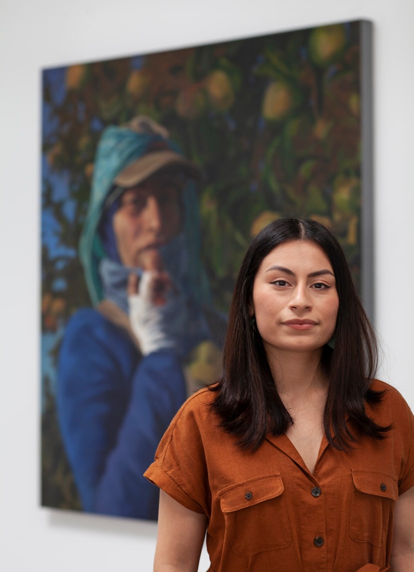 Artist Arely Morales with her painting 'Maria,' 2017, oil on canvas. Photograph by Nan...