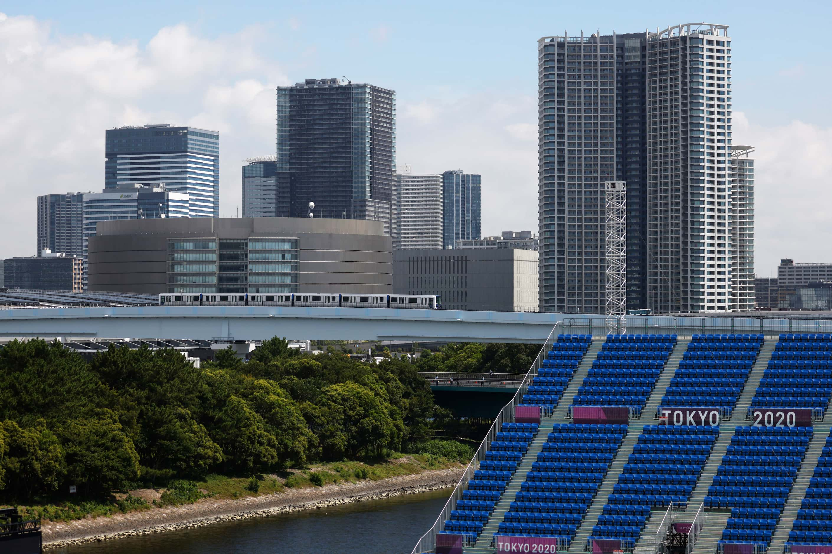 Empty seats are seen against the skyline during the women’s skateboarding prelims at the...