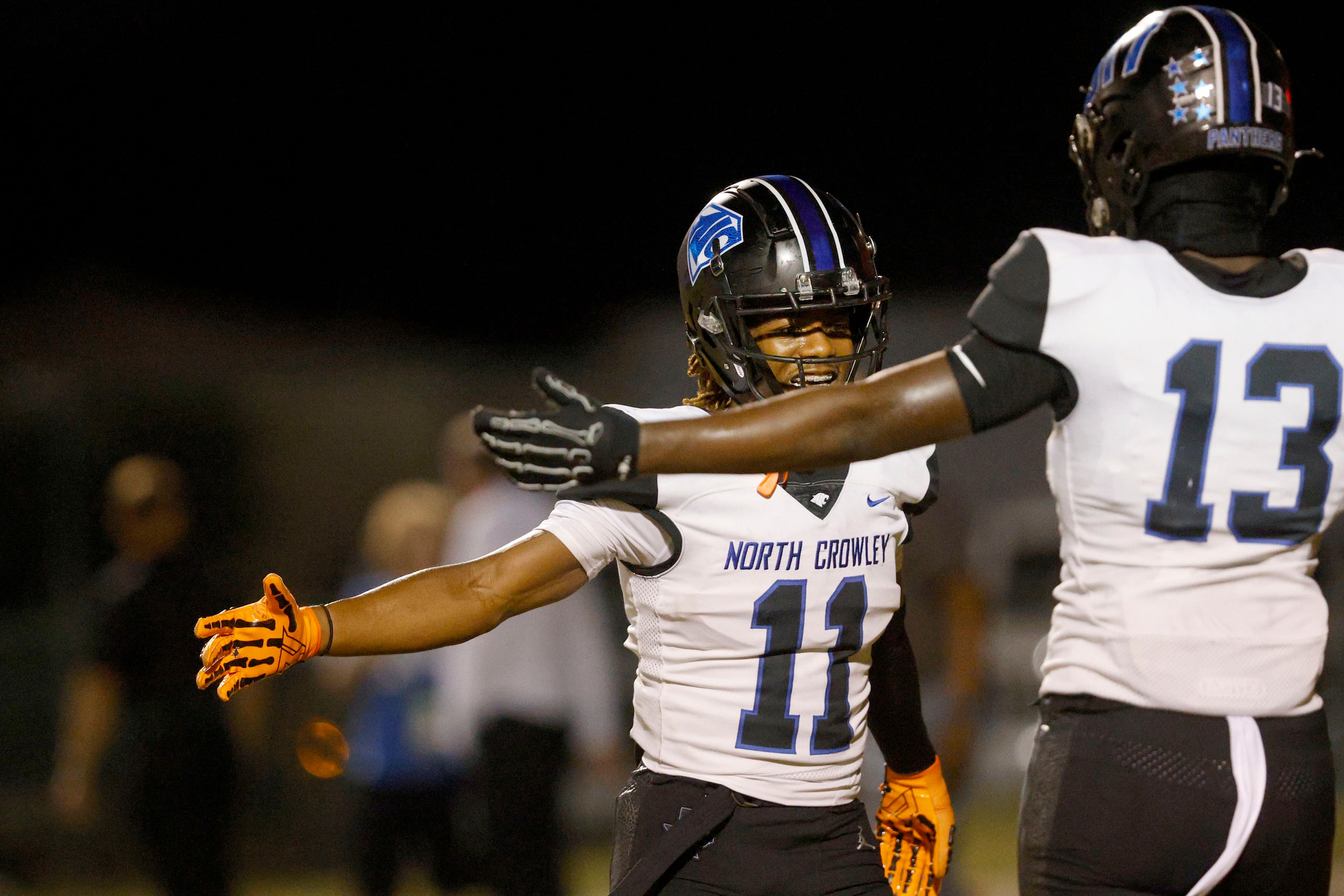 North Crowley's Cam Hunter (11) celebrates with his teammate North Crowley's Jeramie Cooper...