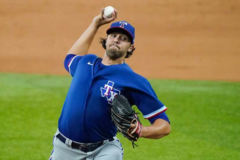 Texas Rangers pitcher Tyler Phillips delivers during a game between players at the team’s...