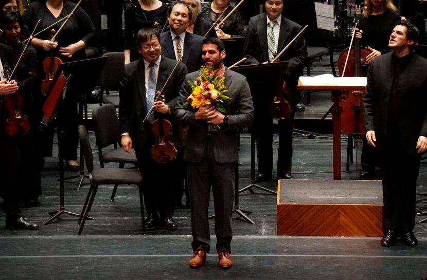Composer Jimmy Lopez takes a bow after the Fort Worth Symphony Orchestra's performance of...