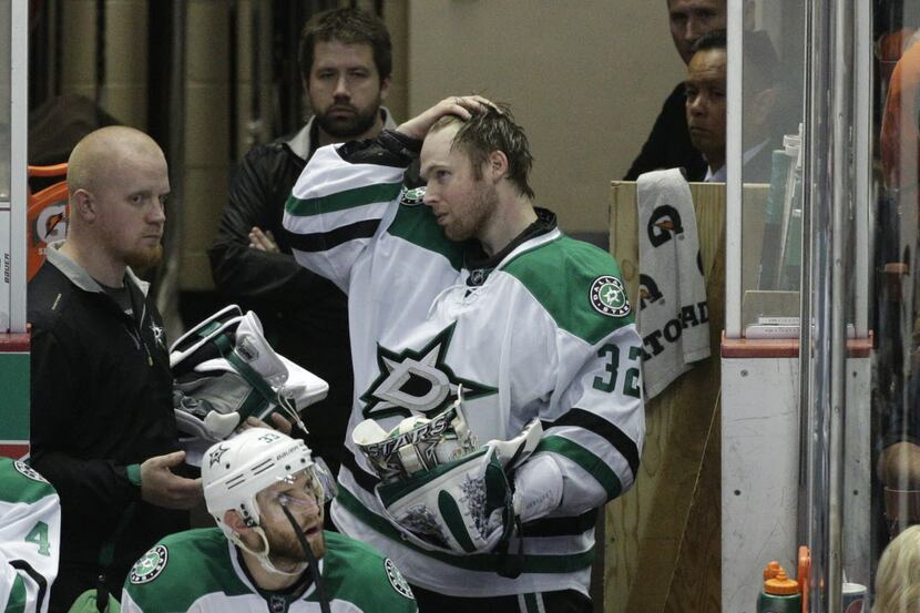 Dallas Stars goalie Kari Lehtonen, of Finland, takes off his mask after he was relieved...
