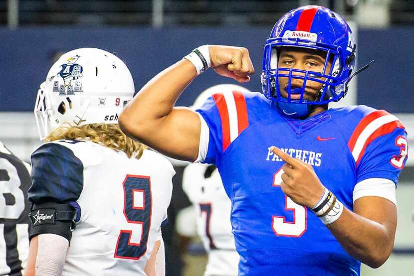 Duncanville quarterback Ja'quinden Jackson flexes after running 40-yards for a touchdown to...