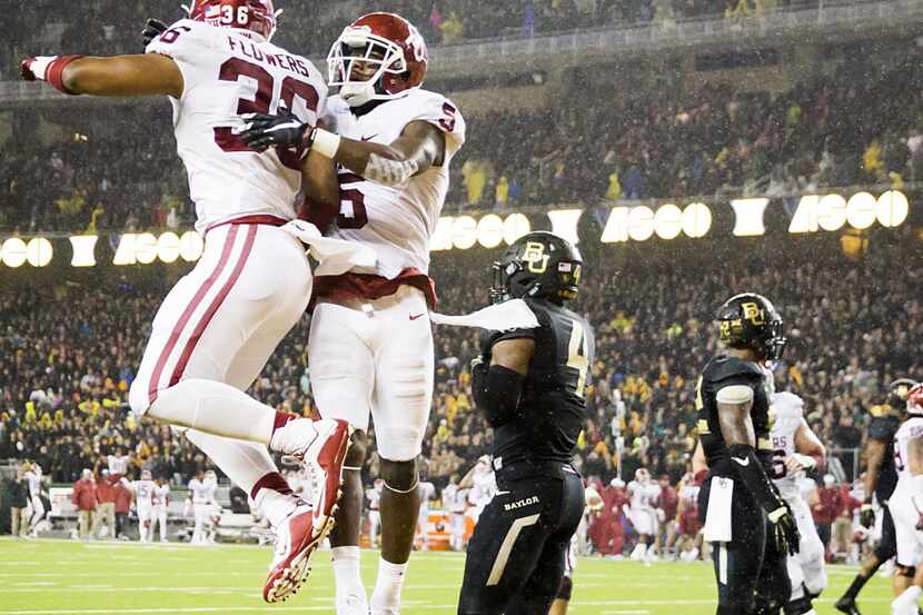 Oklahoma Sooners wide receiver Durron Neal (5) celebrates with fullback Dimitri Flowers (36)...