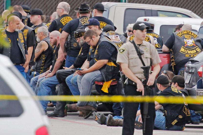 A McLennan County deputy  stood guard near a group of bikers detained in the parking lot of...
