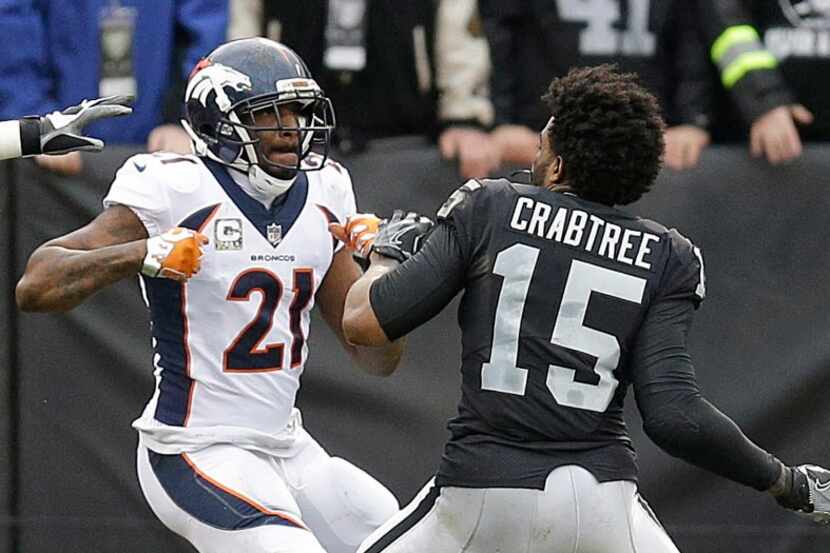 Denver Broncos cornerback Aqib Talib (21) fights Oakland Raiders wide receiver Michael...