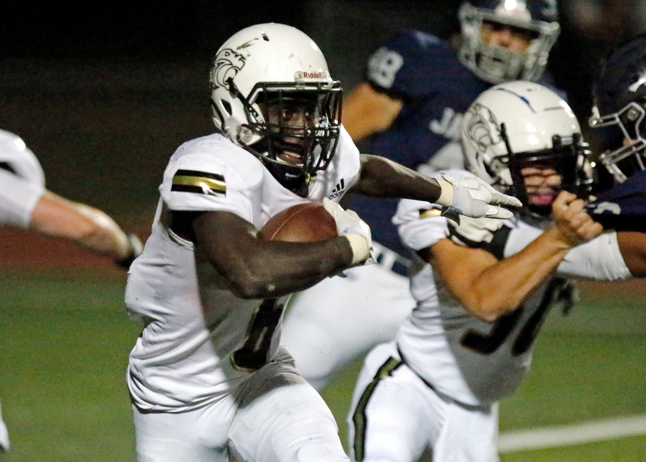 Plano East High School running back Ismail Mahdi (6) carries the football during the first...