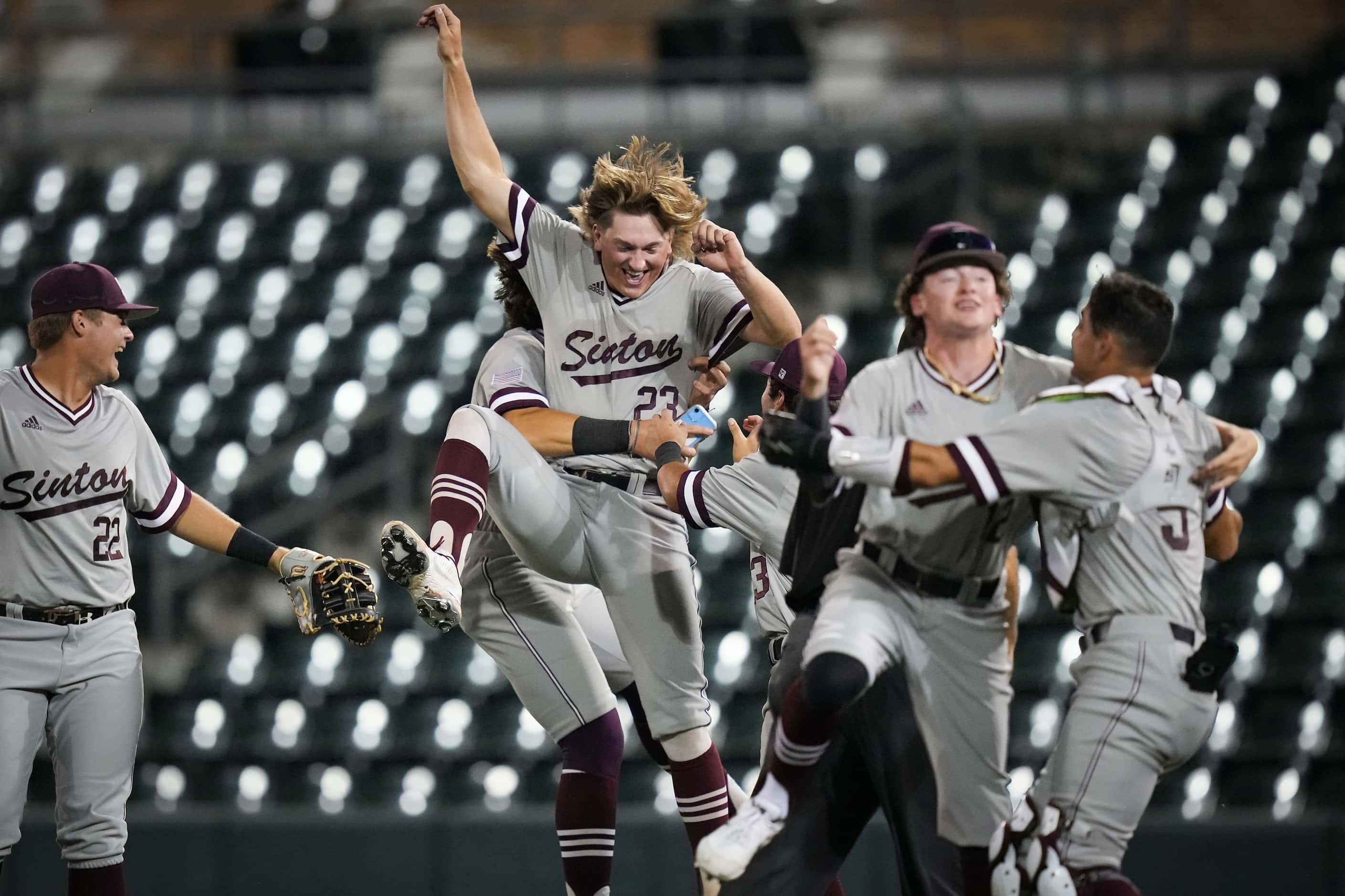Sinton players, including pitcher Wyatt Wiatrek (23) celebrate after defeating Argyle 9-0 to...