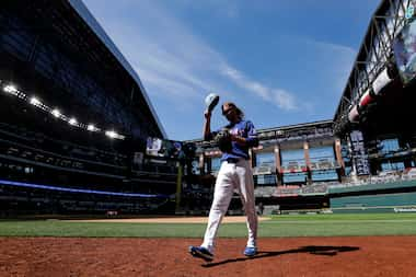 Texas Rangers outfielder Travis Jankowski runs off the field during the eighth inning...