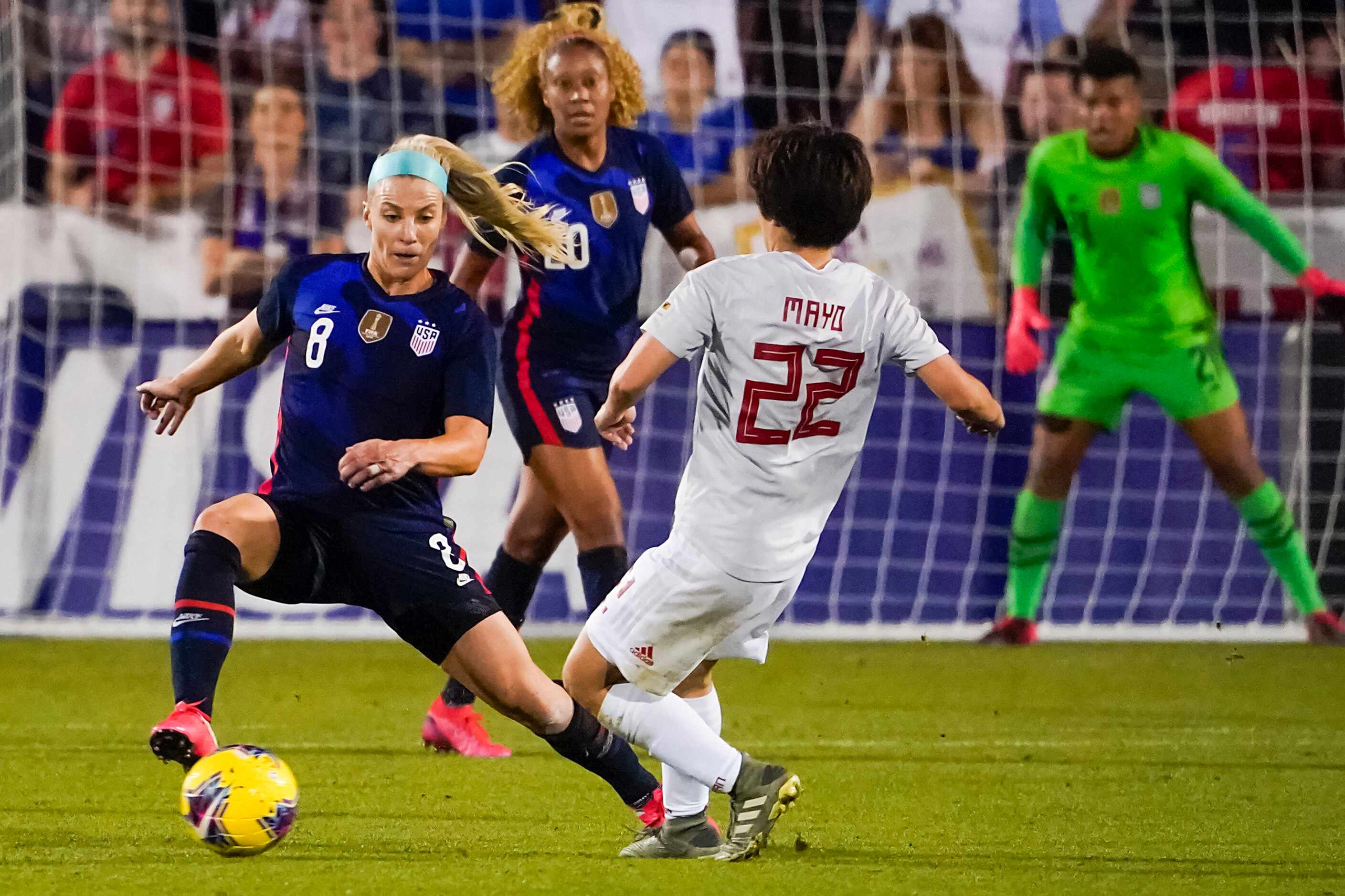 USA midfielder Julie Ertz (8) fights for the ball against Japan defender Mayo Doko (22)...