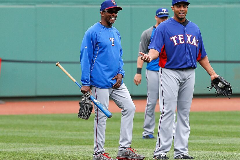 BOSTON, MA - JUNE 5: Nelson Cruz #17 of the Texas Rangers  chats with manager Ron Washington...