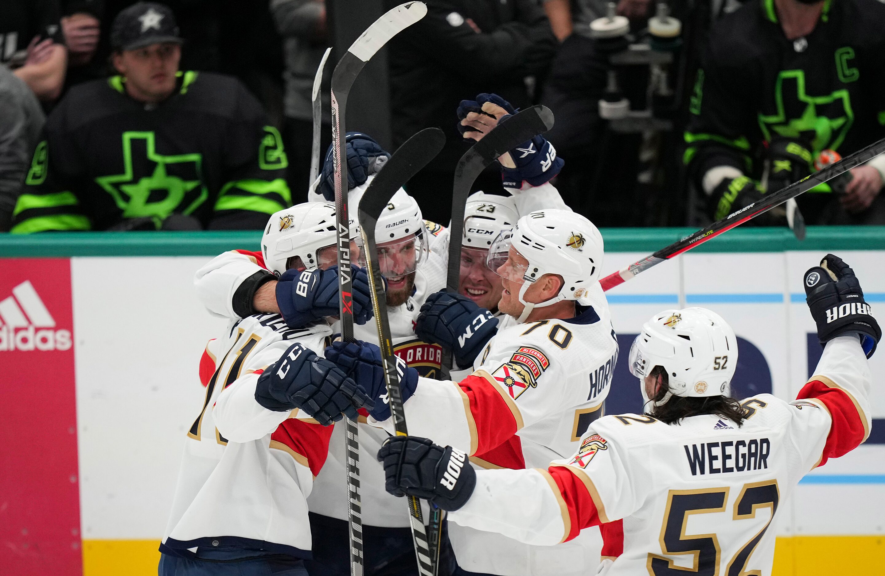 Florida Panthers left wing Jonathan Huberdeau (11) celebrates with defenseman Aaron Ekblad...