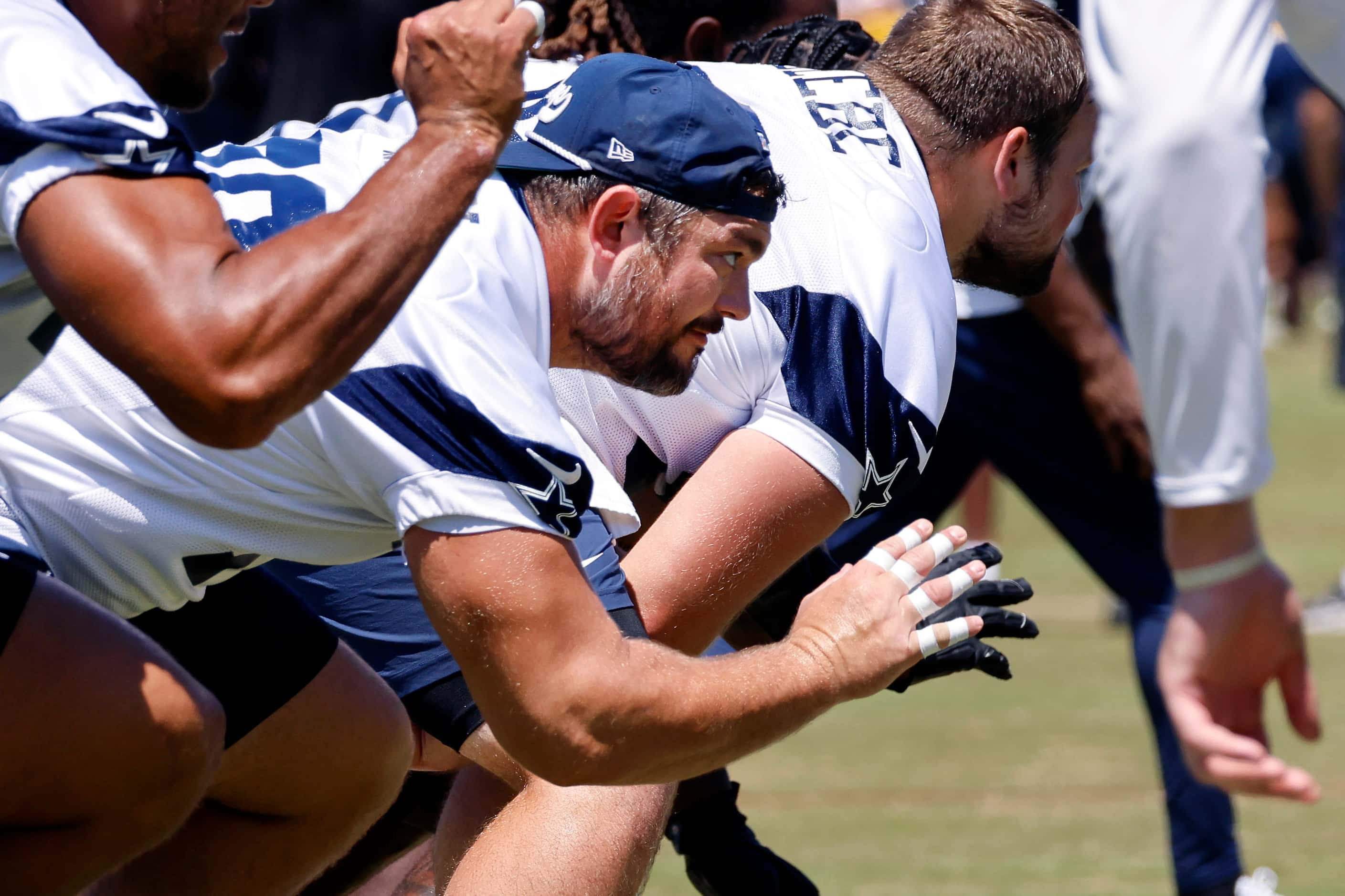 Dallas Cowboys guard Zack Martin (70) launches from his stance during a mock game walk thru...