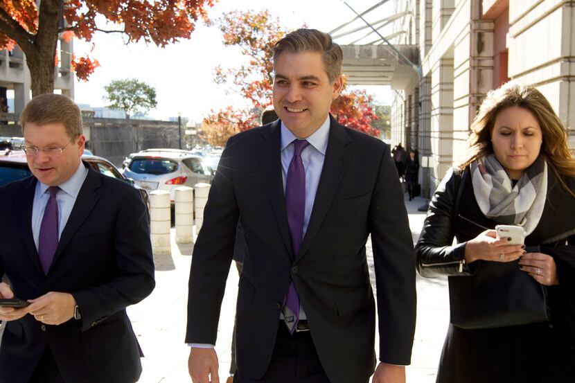 CNN's Jim Acosta walks away from the U.S. District Courthouse, Friday, Nov. 16, 2018, in...